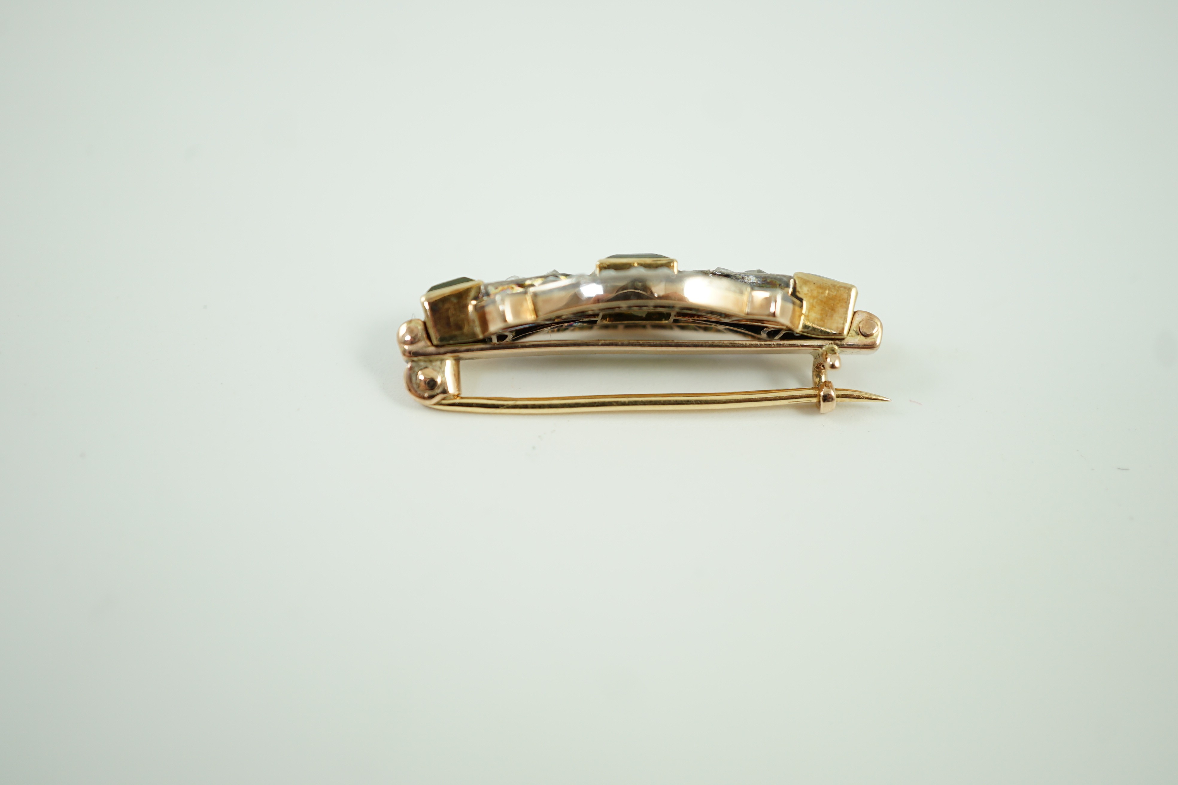 A late Victorian yellow metal, peridot and rose cut diamond set brooch, 31mm, gross weight 4.9 grams.